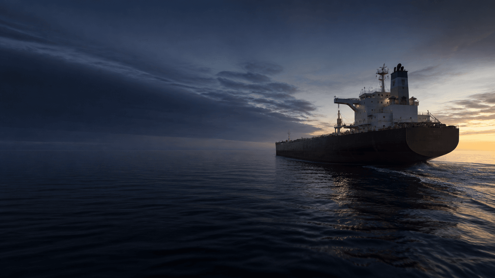 Dry bulk carrier underway at dawn