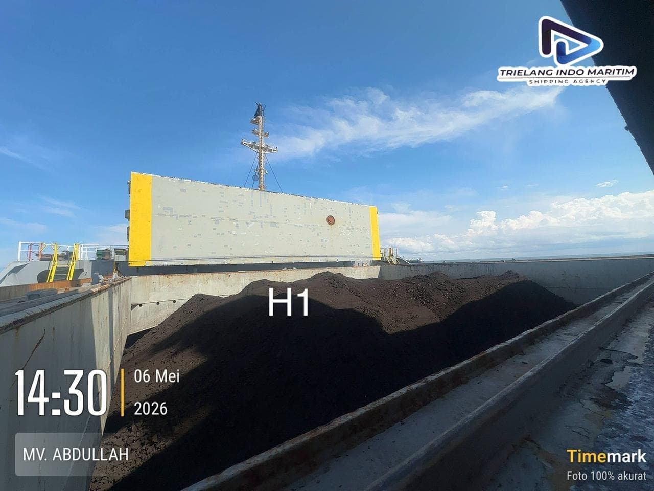 Thermal coal cargo trimmed level inside cargo hold H1 of the vessel.