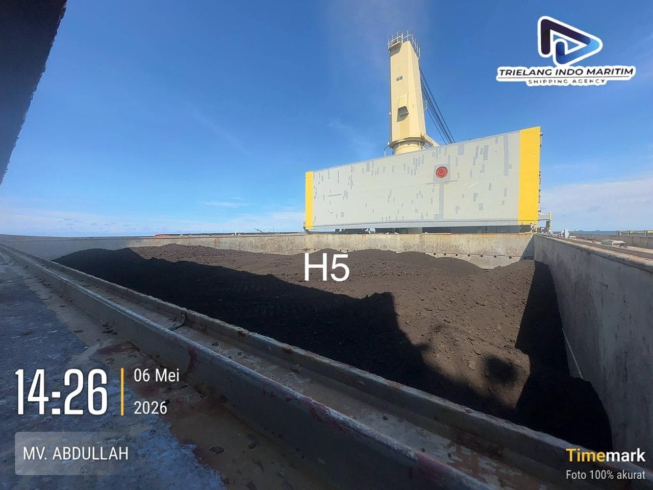 Thermal coal cargo trimmed inside cargo hold H5 of the vessel.